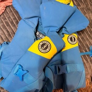 2  Mustang Survival Blue and Yellow Life Jackets